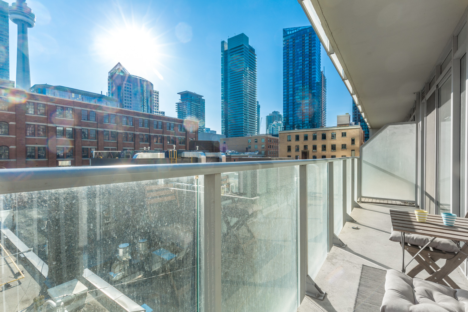 Photo of Toronto condo showing spacious balcony and view of CN Tower