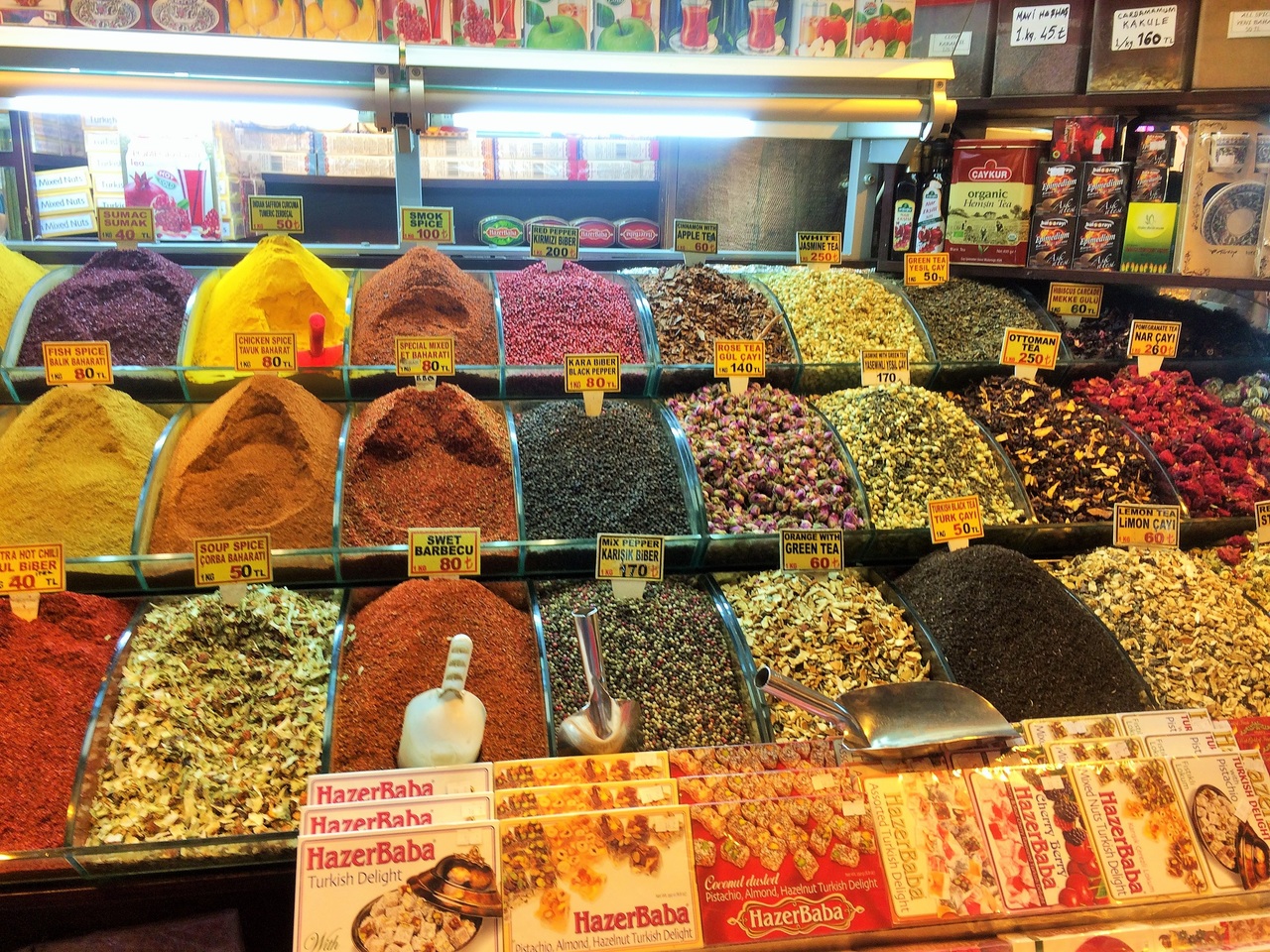 Photo of colourful spices at an indoor market. The best Toronto Real Estate Agents.. because, so, due to, while, since, therefore