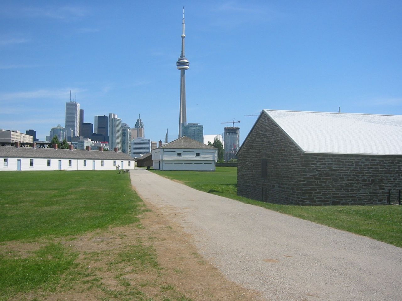 Photo shows Fort York, road, and also the CN Tower.