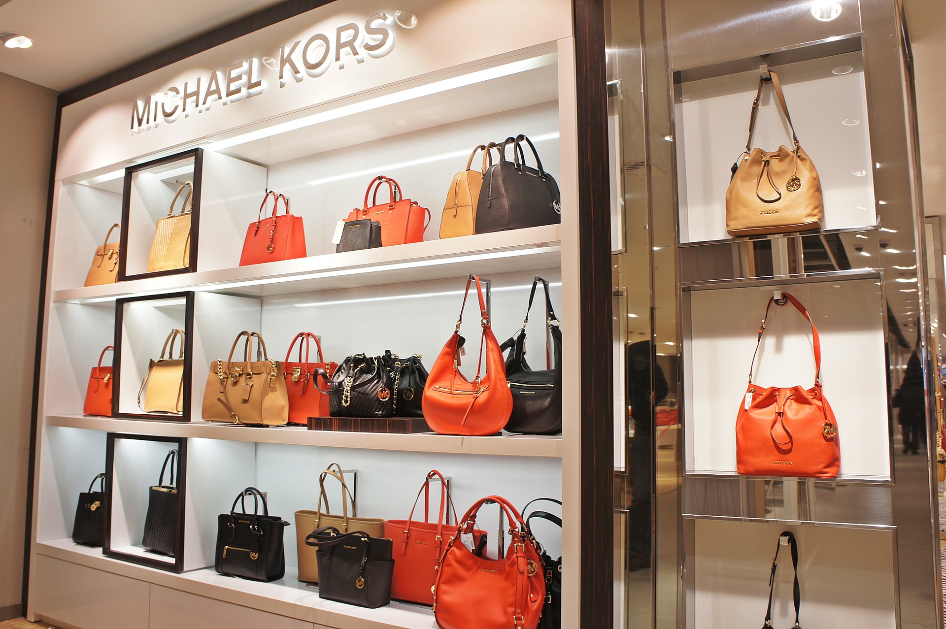 Photo of Michael Kors department store with purses.