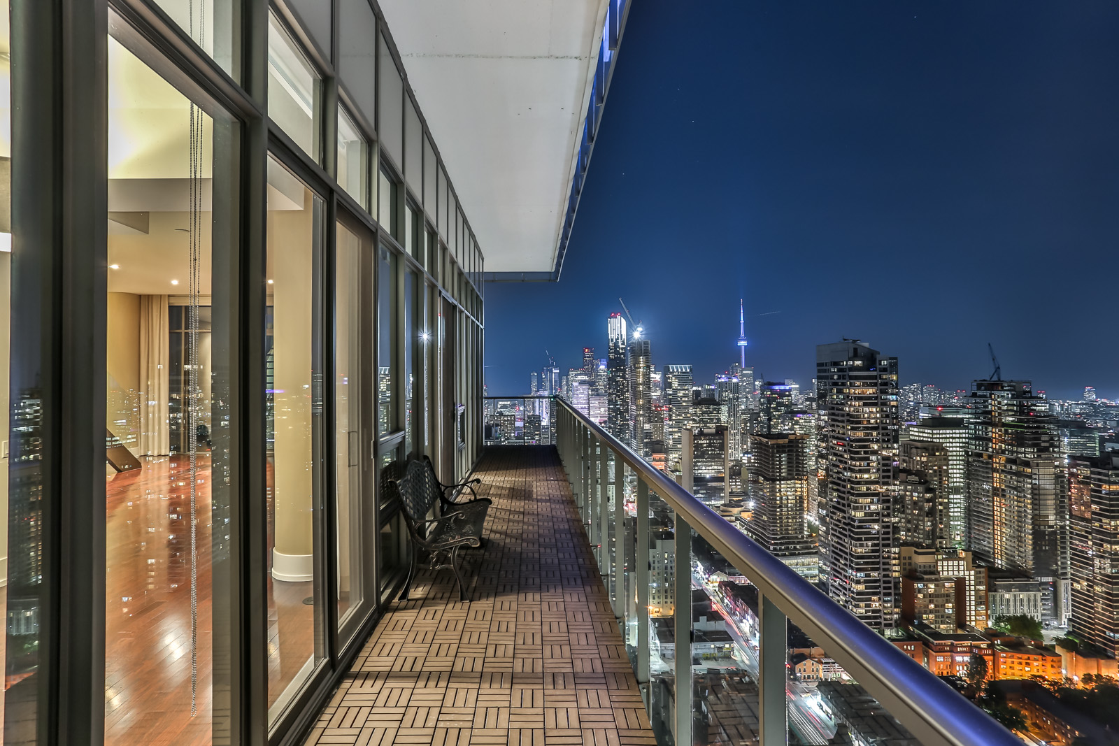 Another exterior shot; this one shows the balcony and Toronto at night.