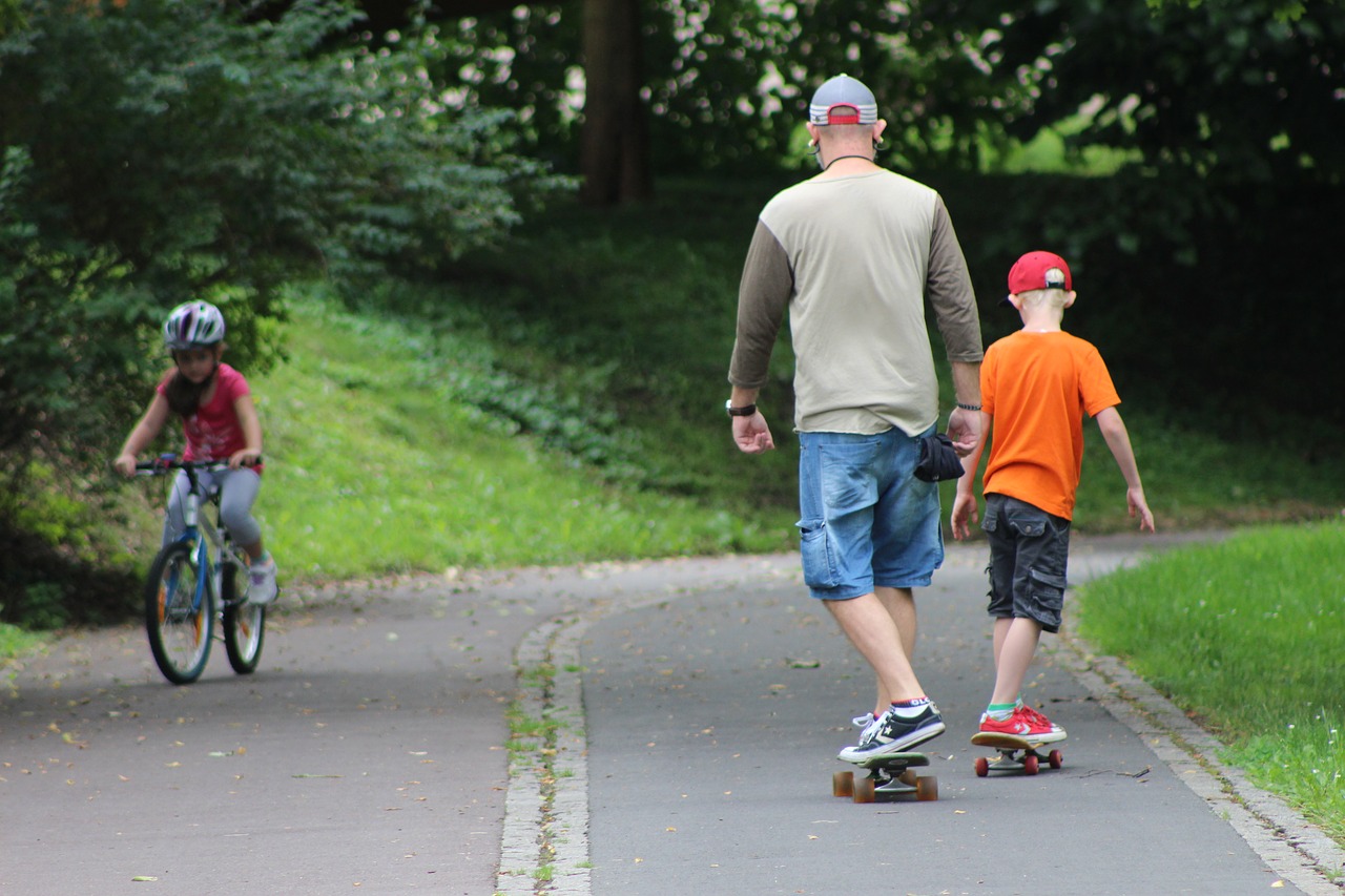 Another image of green-spaces. This one shows father and son skateboarding, showing how family-friendly the neighbourhood is.