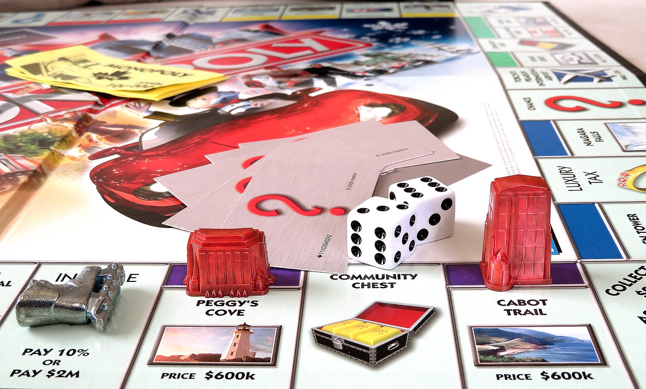 Monopoly board with dice and pieces