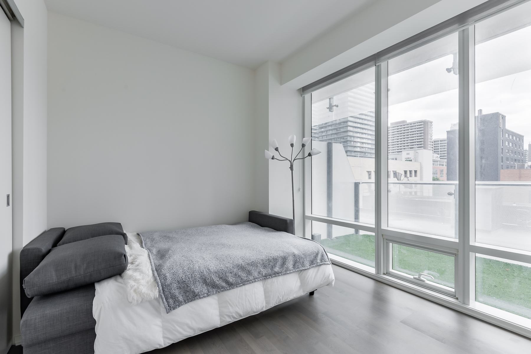2nd bedroom and balcony view - 1 Bloor St E Unit 310 Toronto.