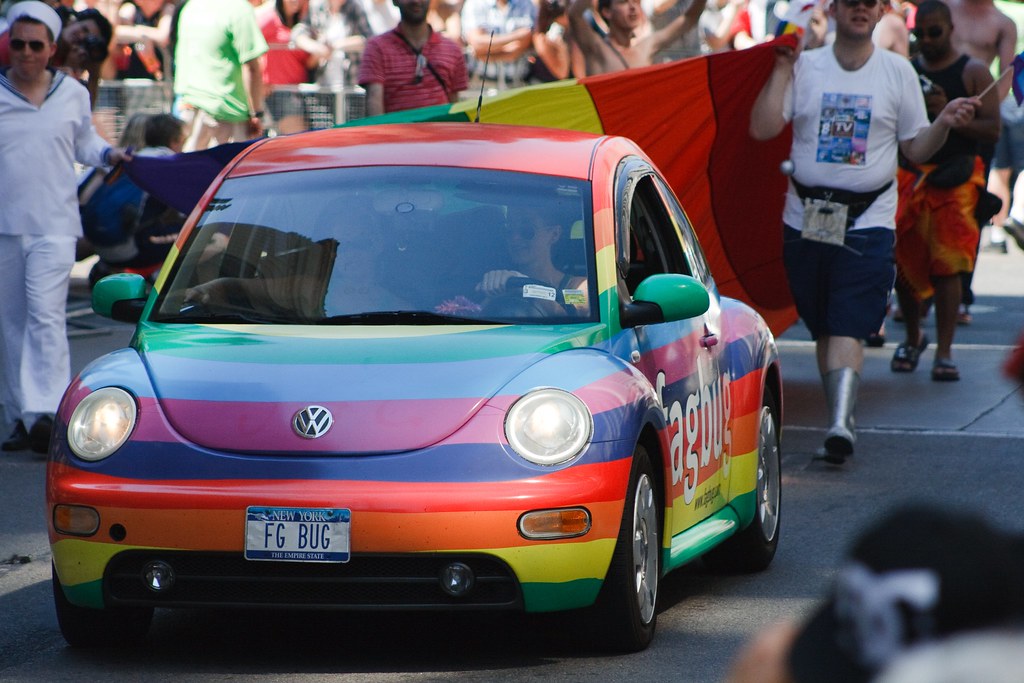 Rainbow-coloured Volkswagen Beetle at Pride Week celebrations in Toronto.