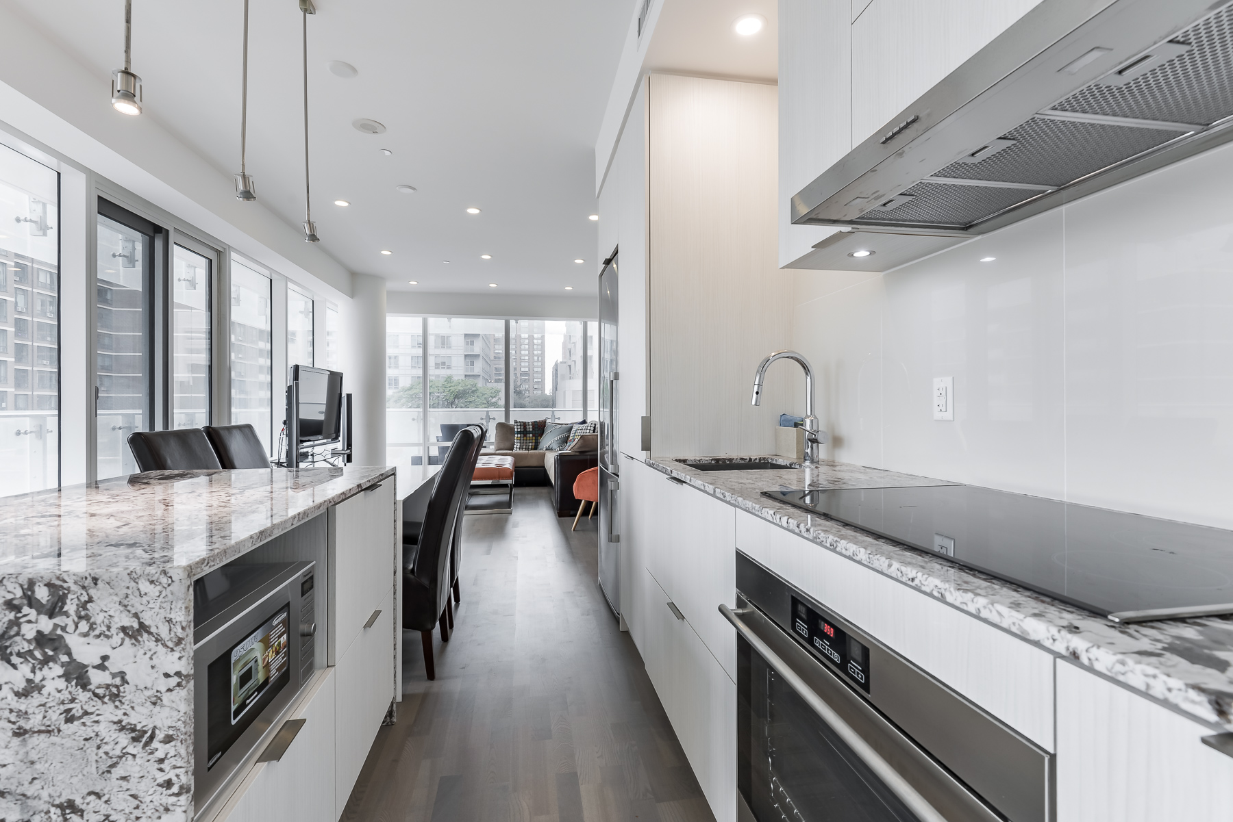 Close up of kitchen, island and appliances at 1 Bloor St E Unit 310 Toronto.