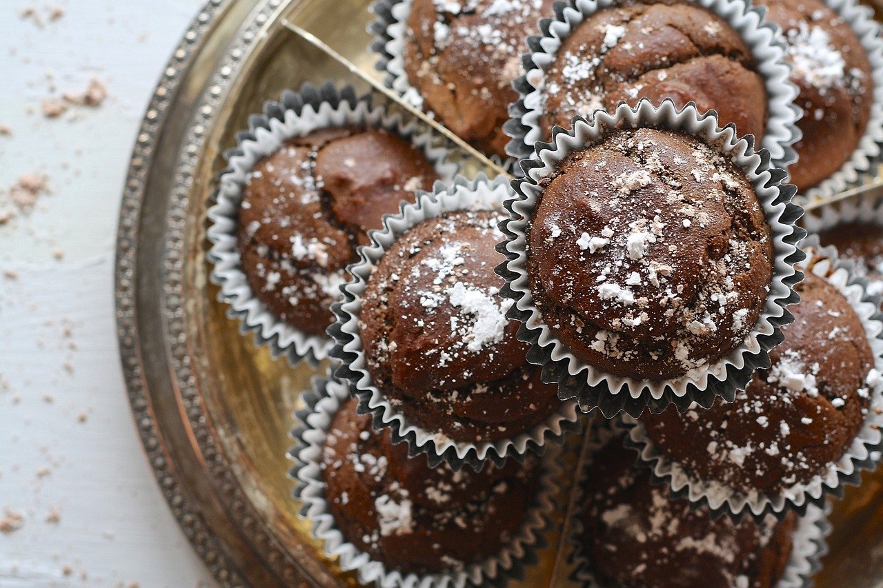 Chocolate cupcakes with white powder.