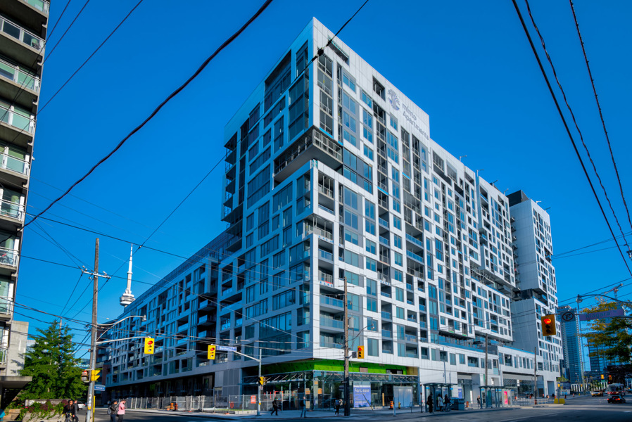 Exterior of Minto Condos at the corner of Front St and Bathurst in King West, Toronto.