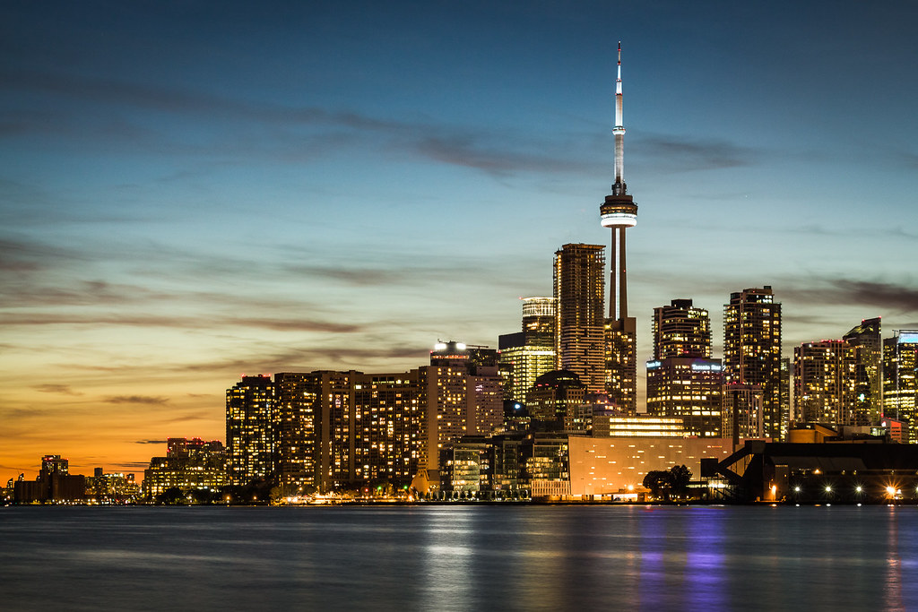 Toronto skyline from Lake Ontario showing CN Tower and other buildings in the GTA real estate market.