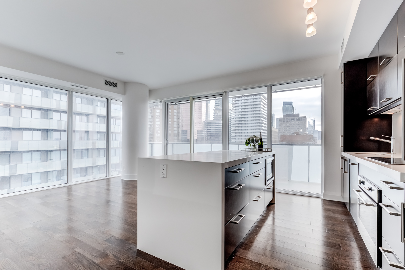 Empty living and dining room of U Condominiums at 65 St Mary St Unit 1502, the third most expensive property I sold.