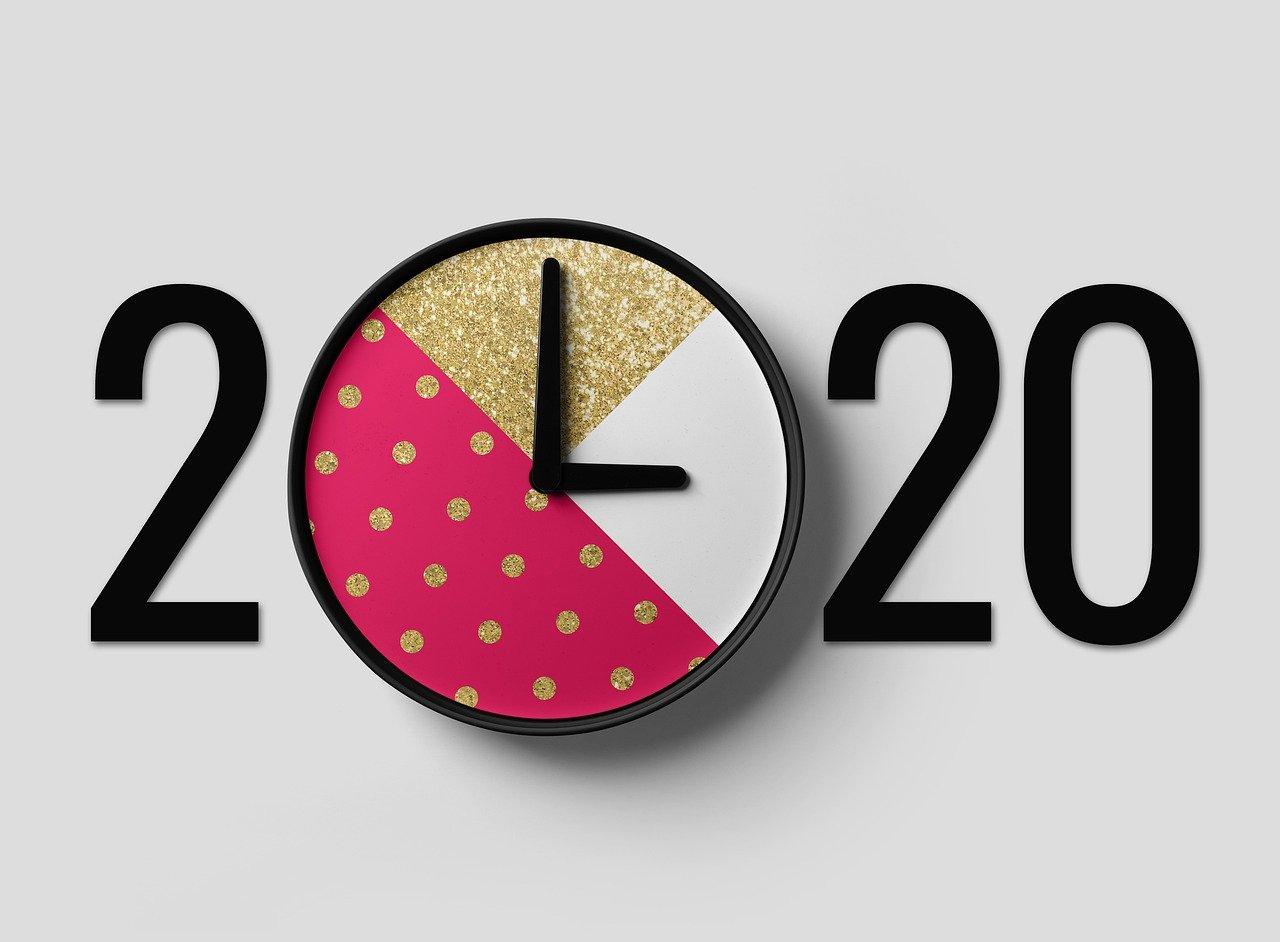 Numbers 2020 with analog clock standing in for first zero in 2020.