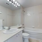 12 newly renovated 4 piece ensuite bath with white counters cabinets soaker deep lights large vanity