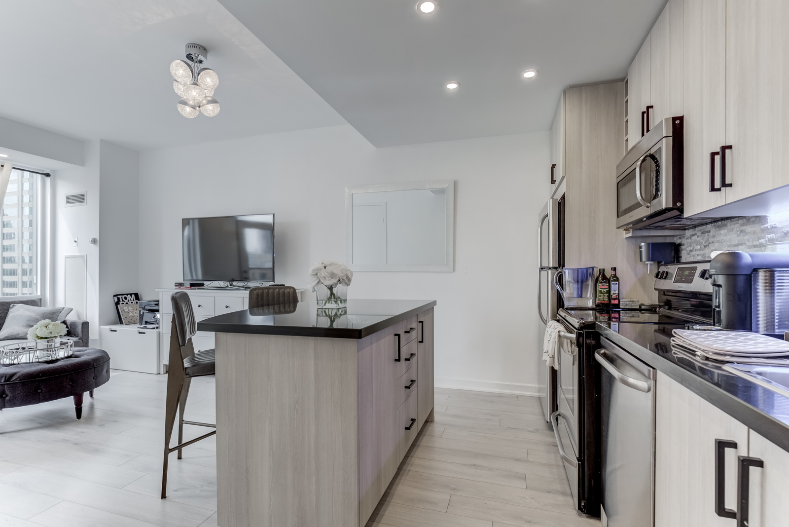 85 Bloor Unit 1814 kitchen with linear design and modern appliances.