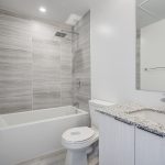 14 condo washroom with white soaker tub