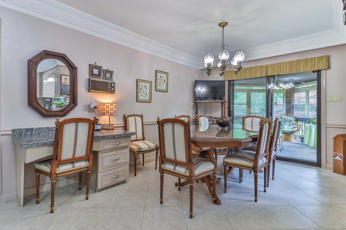 Dining room with granite desk attached to wall