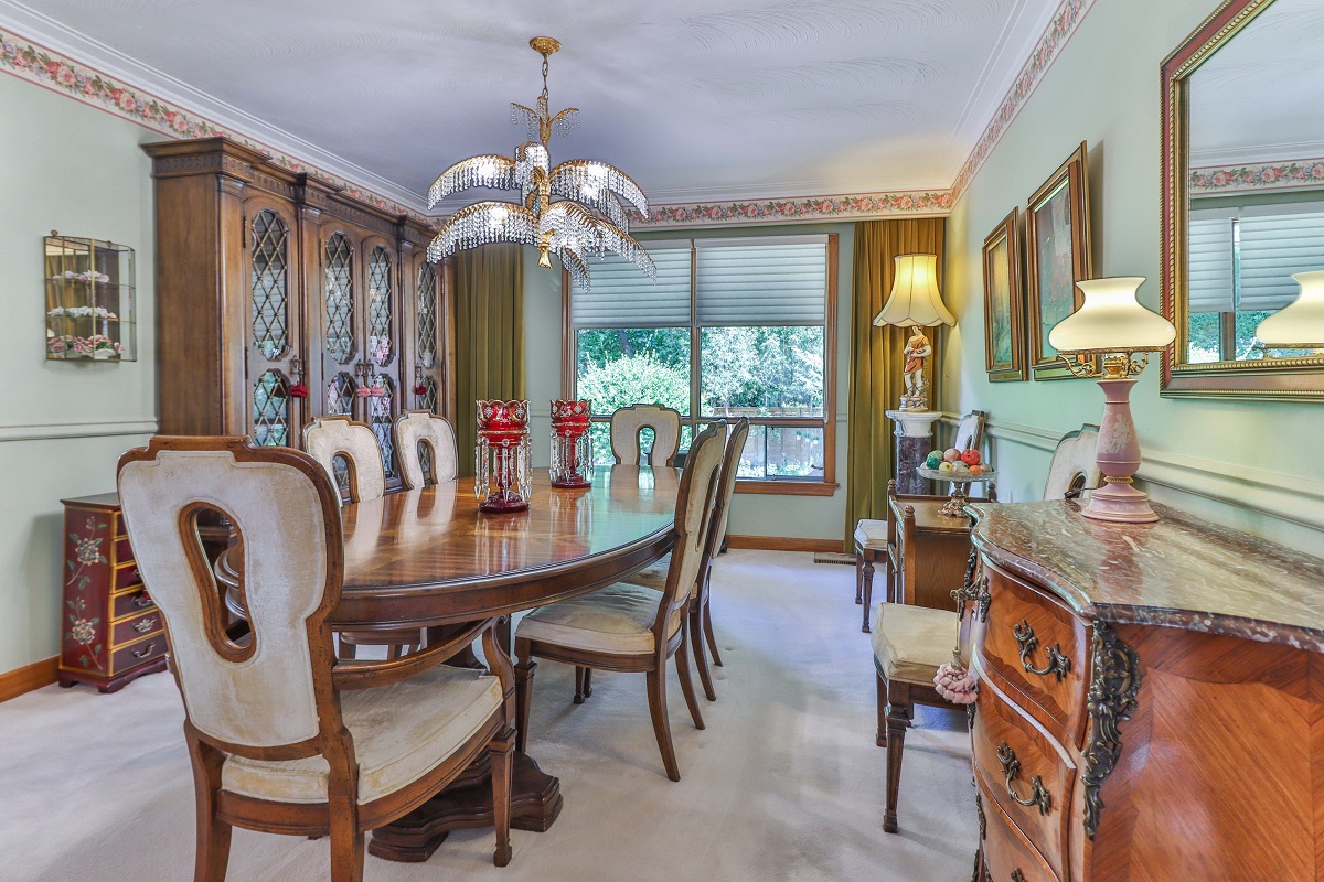 6 Parmbelle Cres dining room with huge cabinets, hutches and sideboard with fruits and lamps.