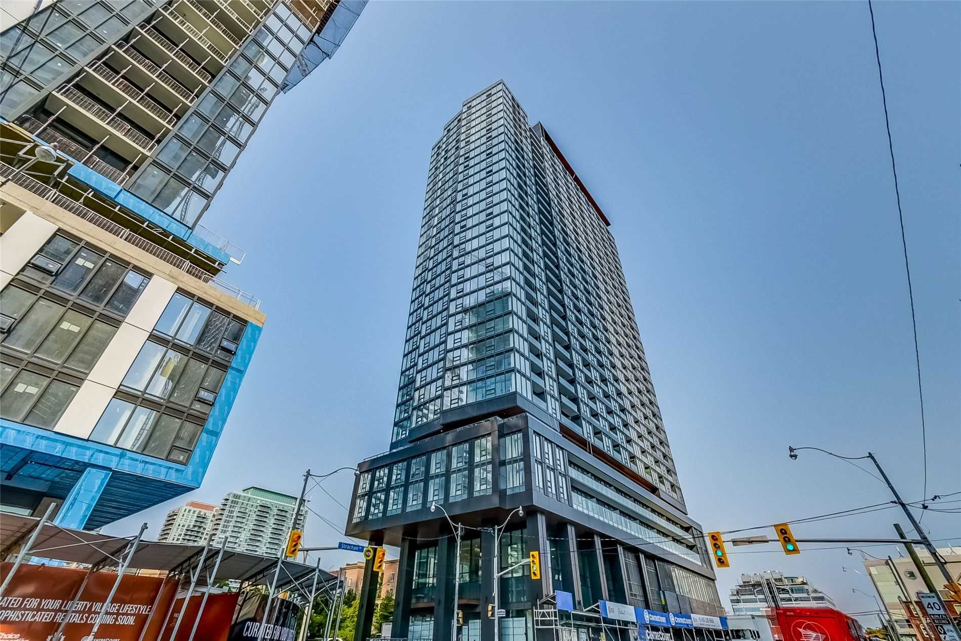 Street view of 19 Western Battery Rd, a bluish condo with a glass facade.
