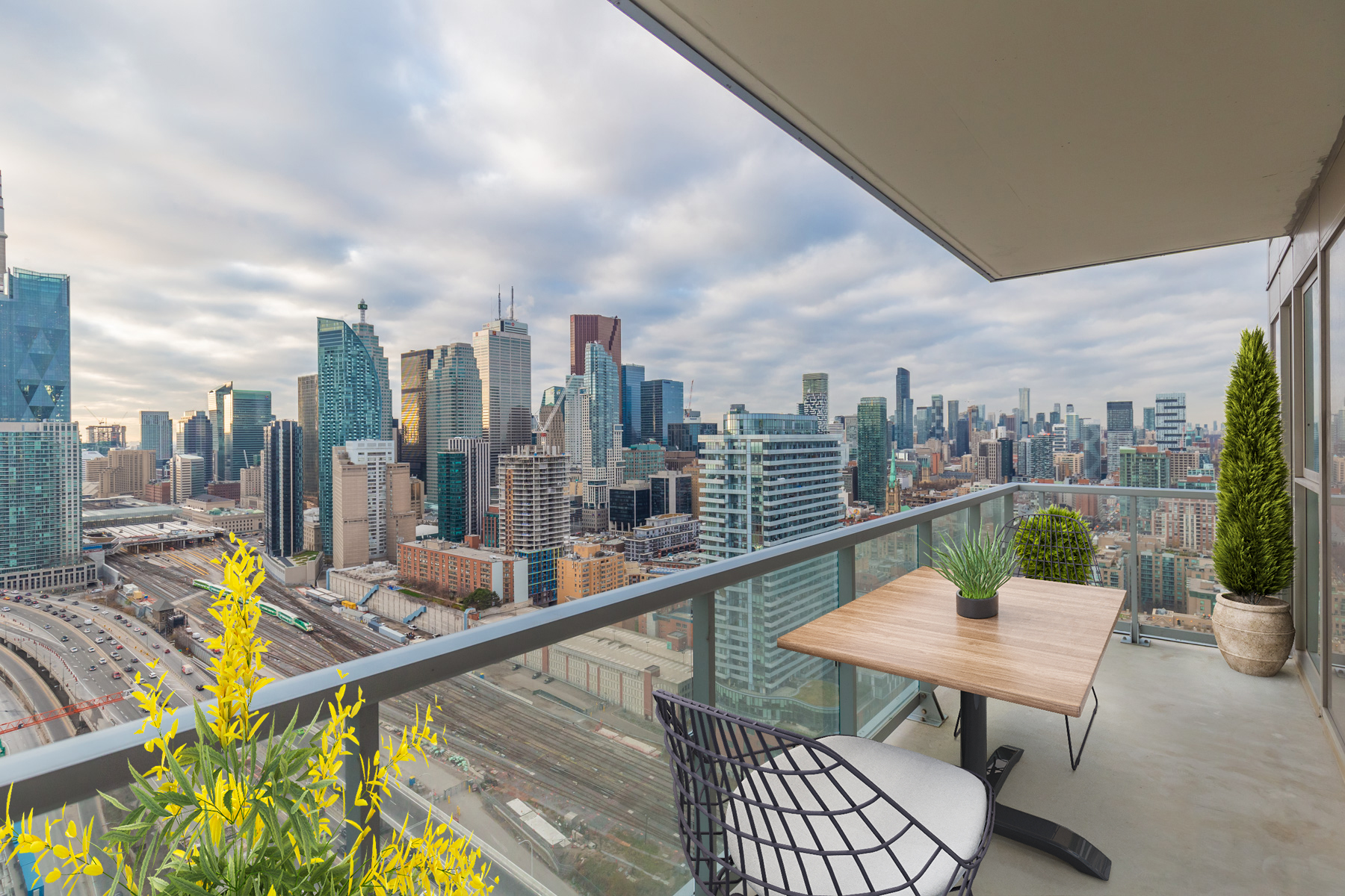 20 Richardson St Unit 3108 Virtually Staged Balcony With Glass Panels 20 Richardson St balcony with glass panels and virtually staged patio furniture.
