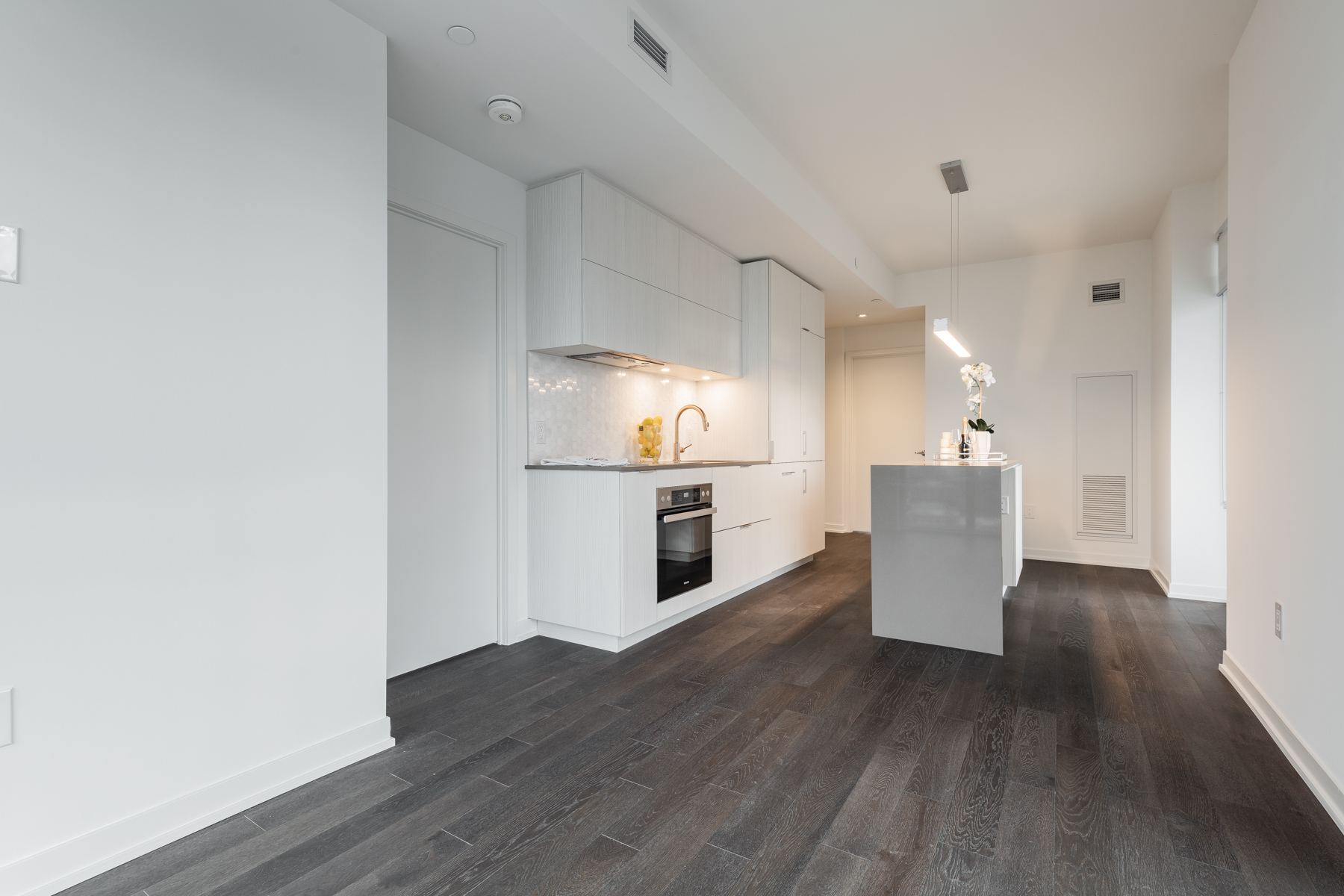20 Richardson Street Unit 3108 dark hardwood floors gray walls Dark hardwood floors and gray walls of 20 Richardson St dining room and kitchen.