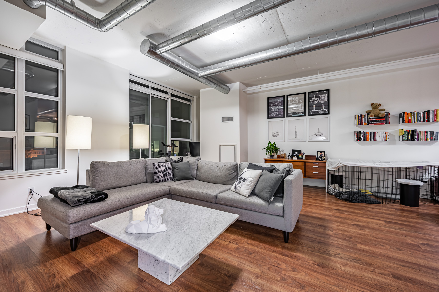 stylish condo living room hardwood floors gray walls Condo living room with hardwood floors and gray walls – 380 Macpherson Ave Suite 517.