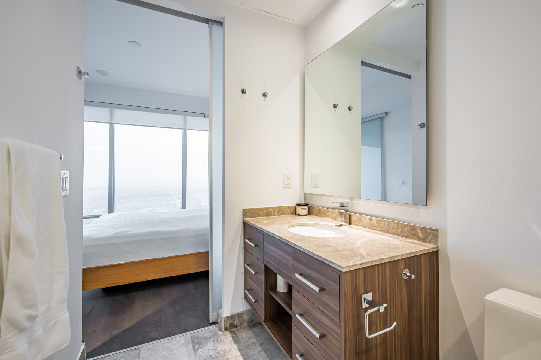 bathroom vanity big mirror Custom-built vanity with large mirror and soft-close drawers.