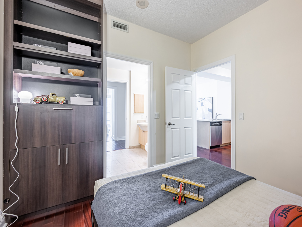 condo den with built in storage desk Den with storage unit with built-in desk.