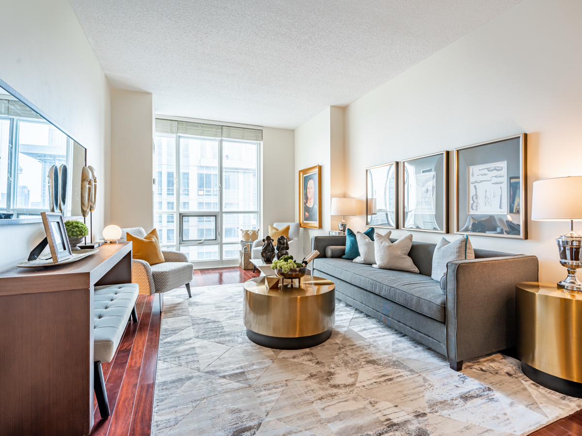 763 Bay St Unit 4705 living room neutral colours beautiful decor Beautifully decorated condo living room with gray walls.