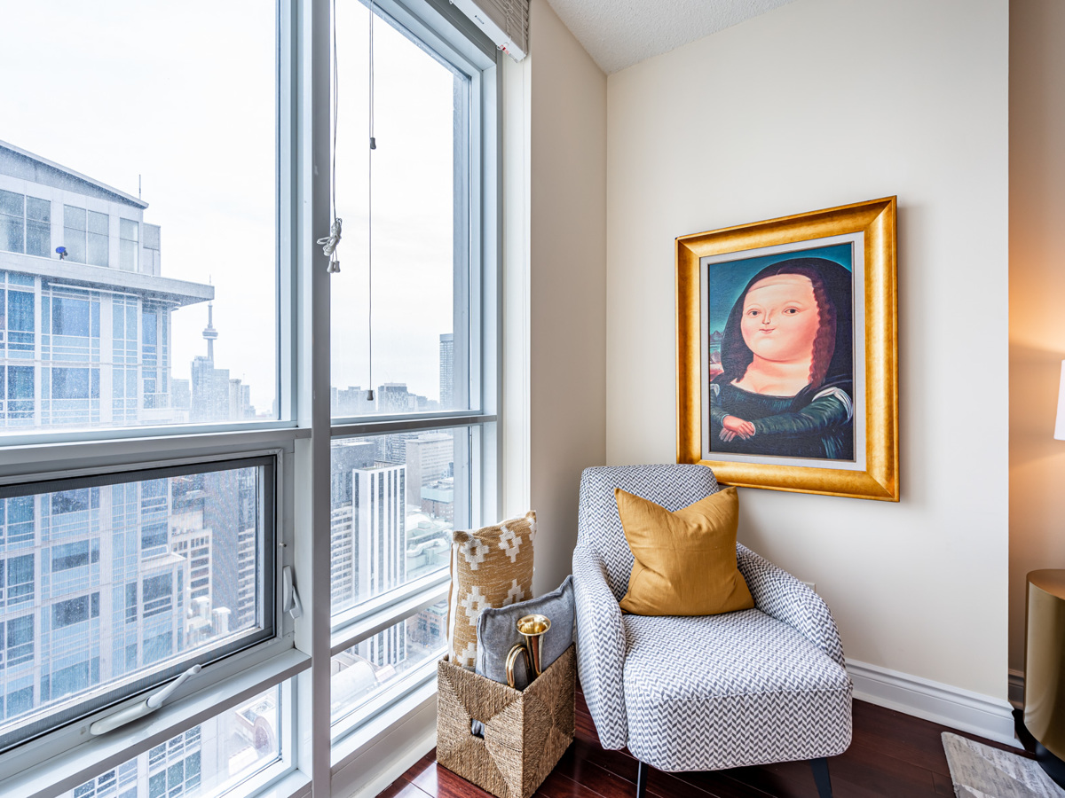 view of Toronto skyline and CN Tower from 763 Bay St Unit 4705 living room Toronto skyline and CN Tower from 763 Bay St Unit 4705 living room windows.