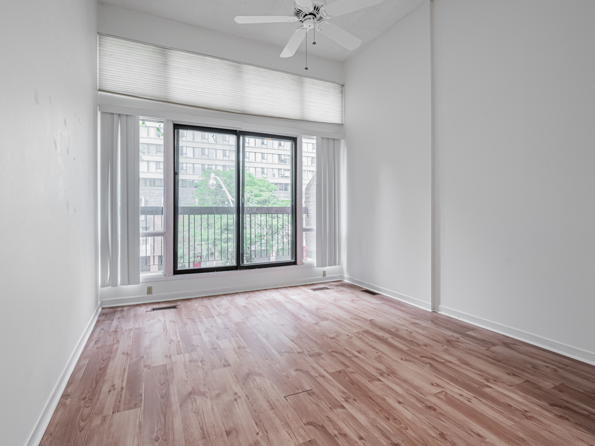 49 Granby Street Primary Room with laminate floors and Hunter Douglas Blinds 13 Bedroom with light brown laminate floors and Hunter Douglas blinds.