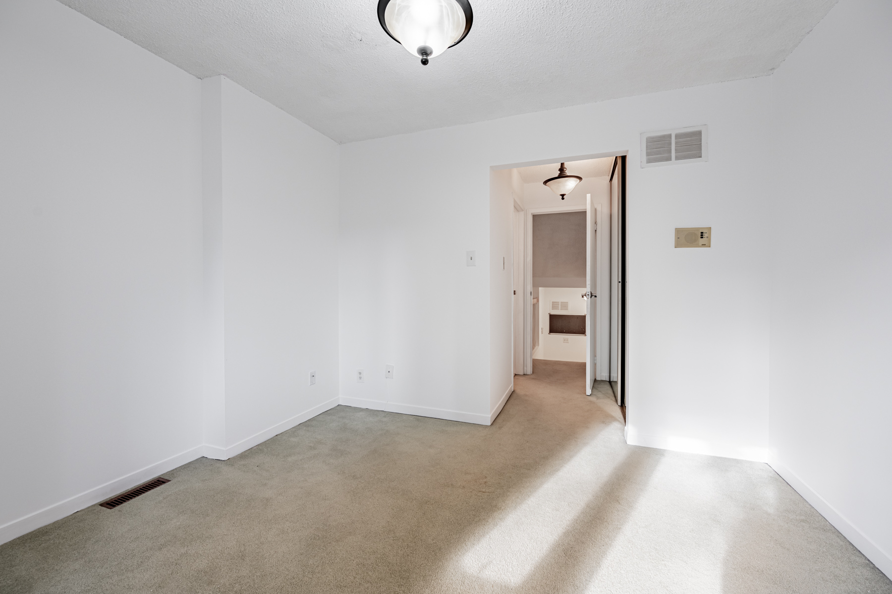 49 Granby Street 2nd bedroom with carpeted floors and bay windows 9 web 1 10