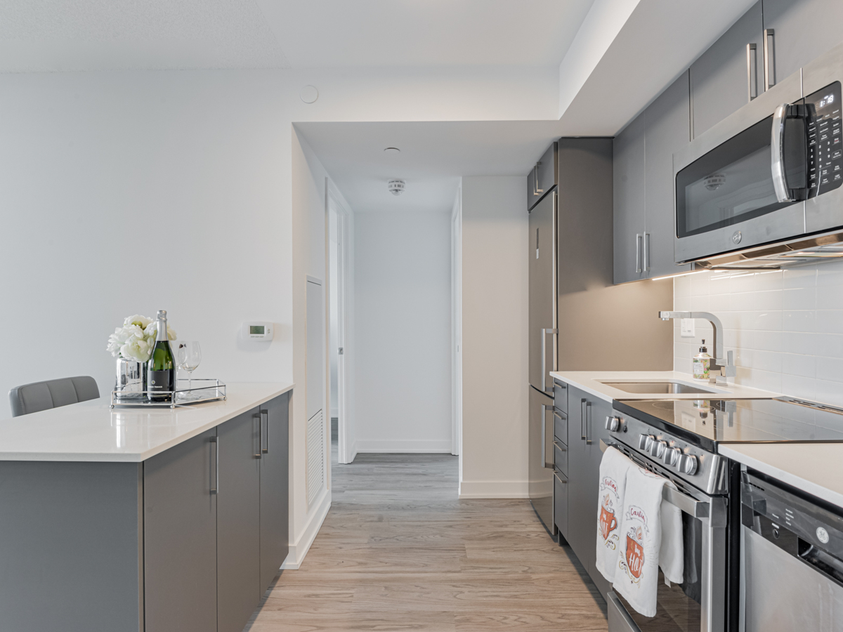 Modern condo kitchen – 38 Monte Kwinter Court Suite 4709.