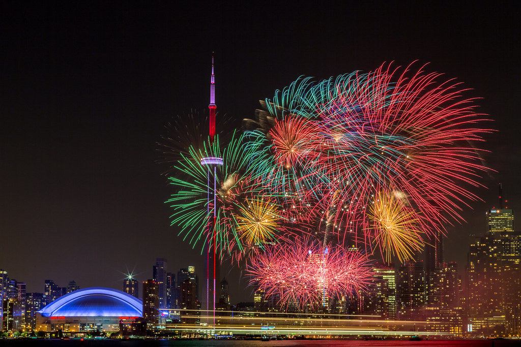 Fireworks in front of CN Tower Toronto in December 2021 celebrating New Year.