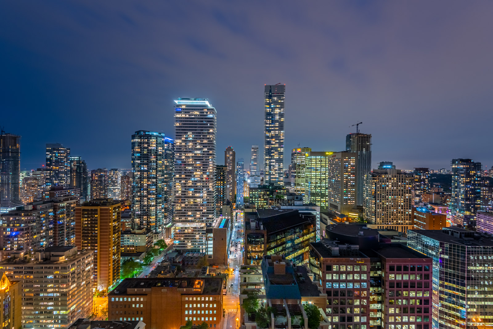 Toronto skyline at night to show selling homes and areas of service.