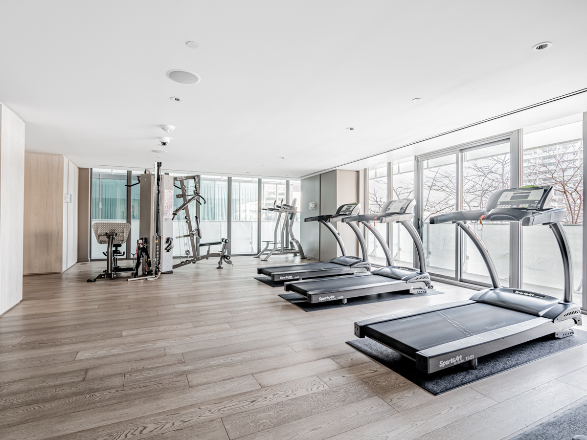 Condo gym with treadmills and other equipment.