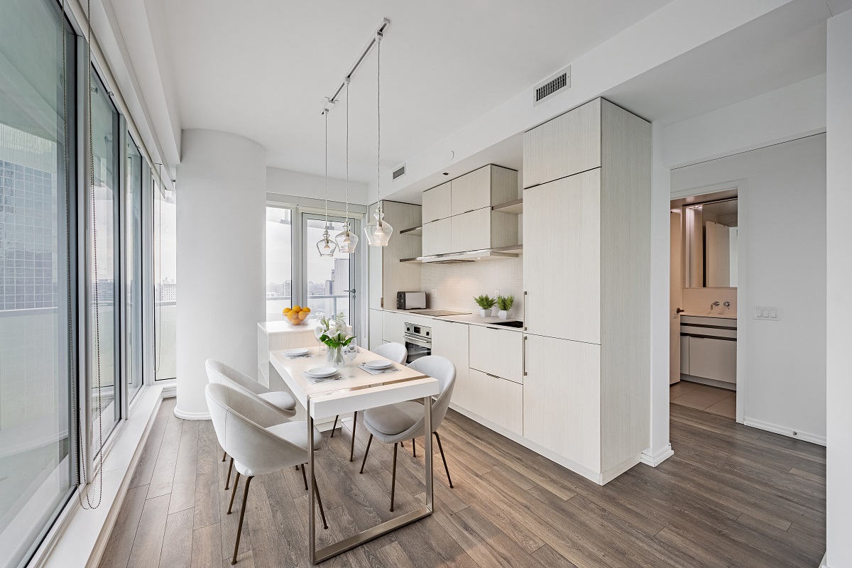 White condo island with metal trim – 197 Yonge St Suite 2209.