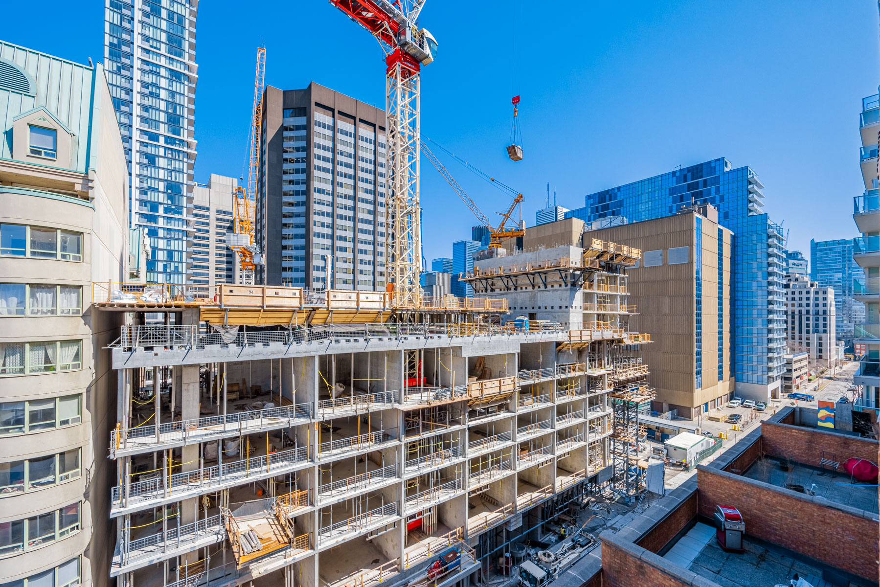 View of condo construction and cranes in Toronto.