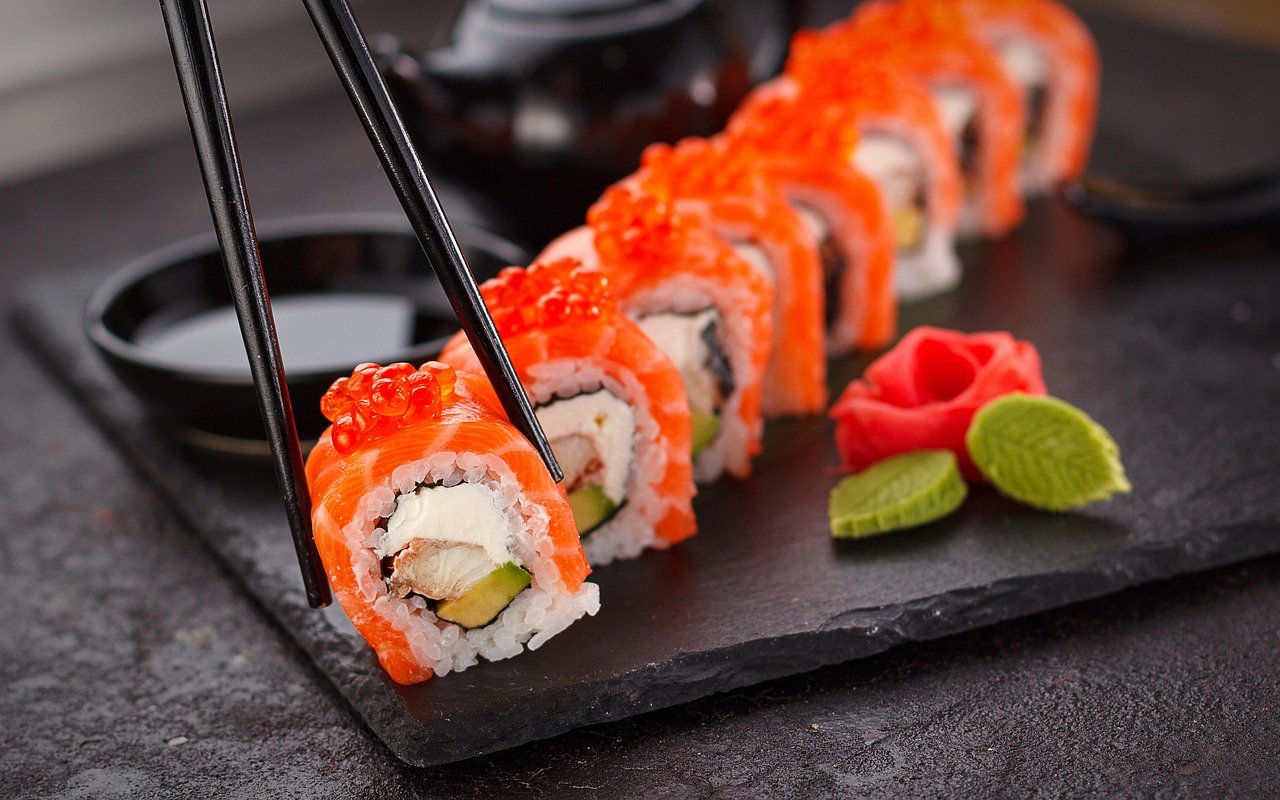 Sushi platter with chopsticks.