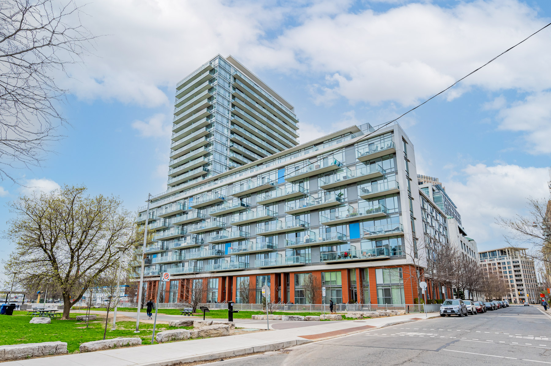 1. Quay West 23 storey glass tower 8 storey podium with staggered balconies 23-storey condo of steel and glass with 8-storey podium – Quay West Condos.