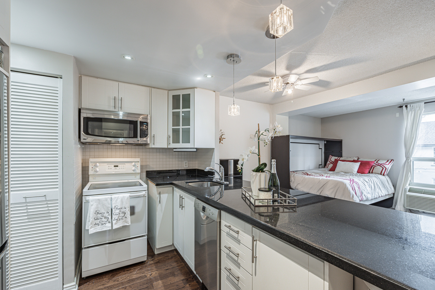 Condo kitchen with pendent lights and pot lights – Suite 204 88 Charles St.