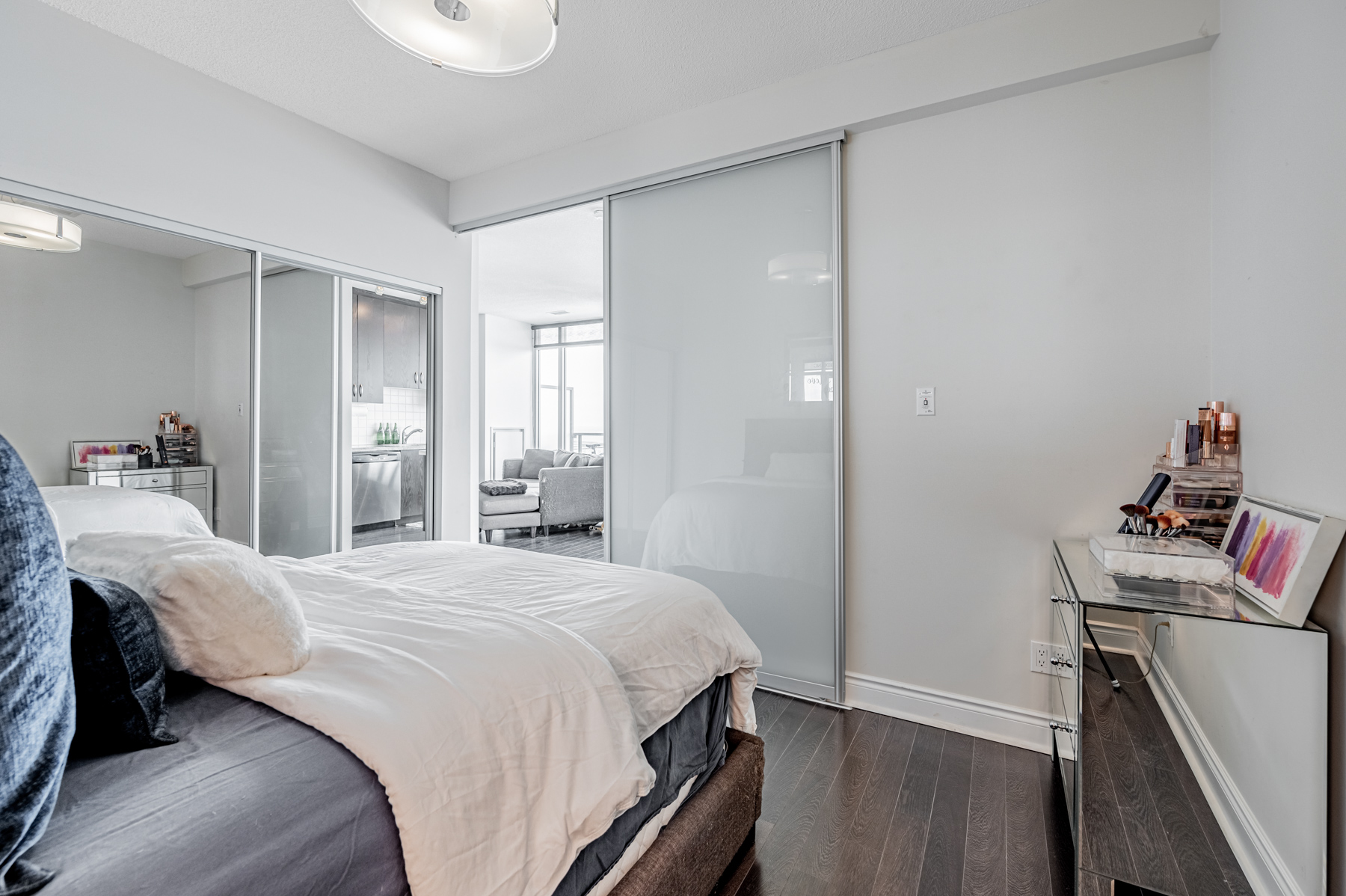 13. condo bedroom with large mirror door closet Condo bedroom with large mirror door closet on left side.