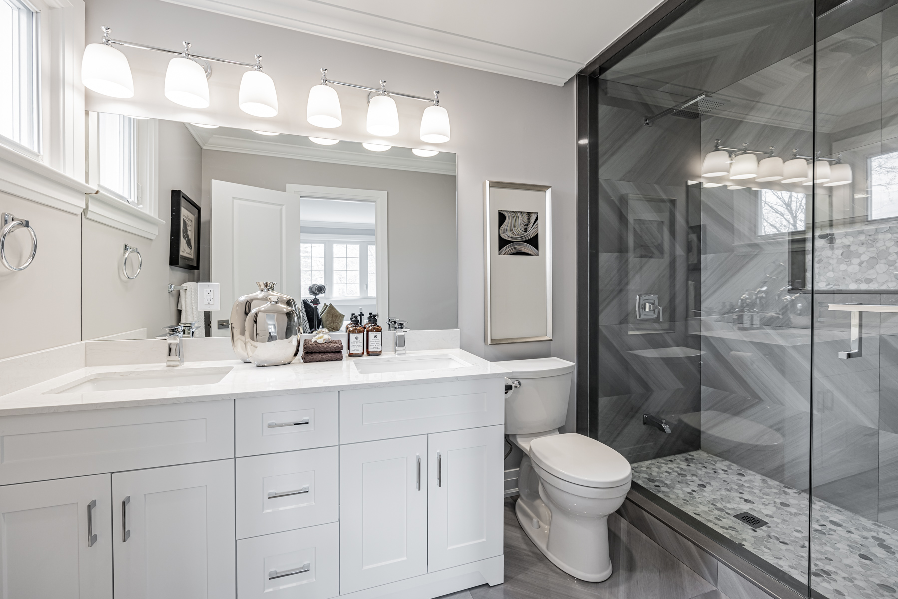 3 Logwood Court primary ensuite bath with glass shower and porcelain slabs.