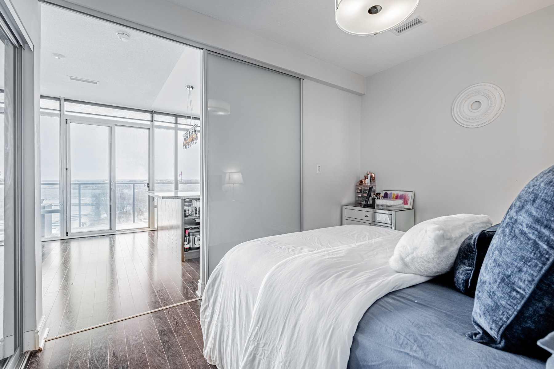 14. condo bedroom with wide sliding door Condo bedroom with sliding door.