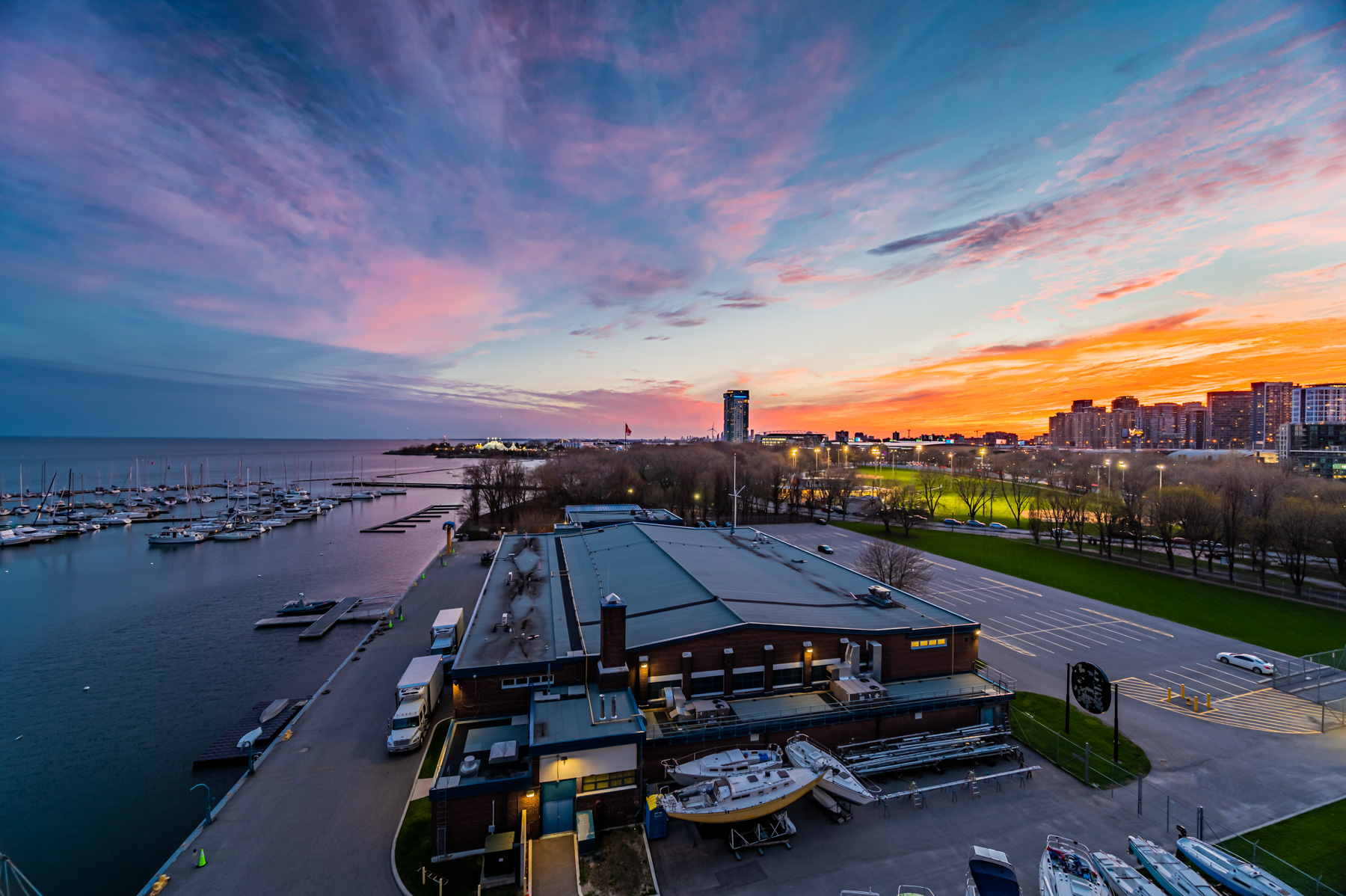 26. Evening Lake Ontario Orange SKies View of Toronto Waterfront and boats at dusk from 90 Stadium Rd balcony.