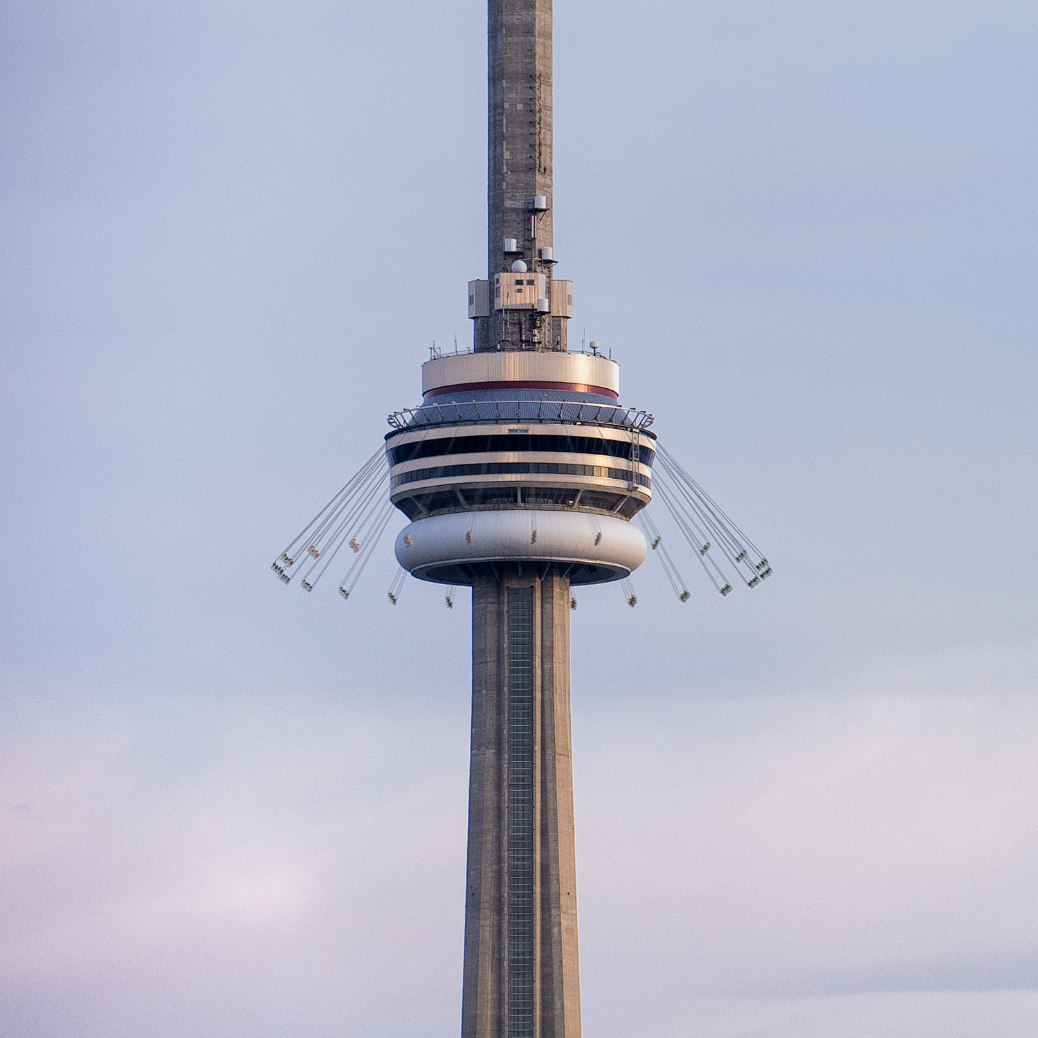 People suspended from CN Tower Edge Swing.