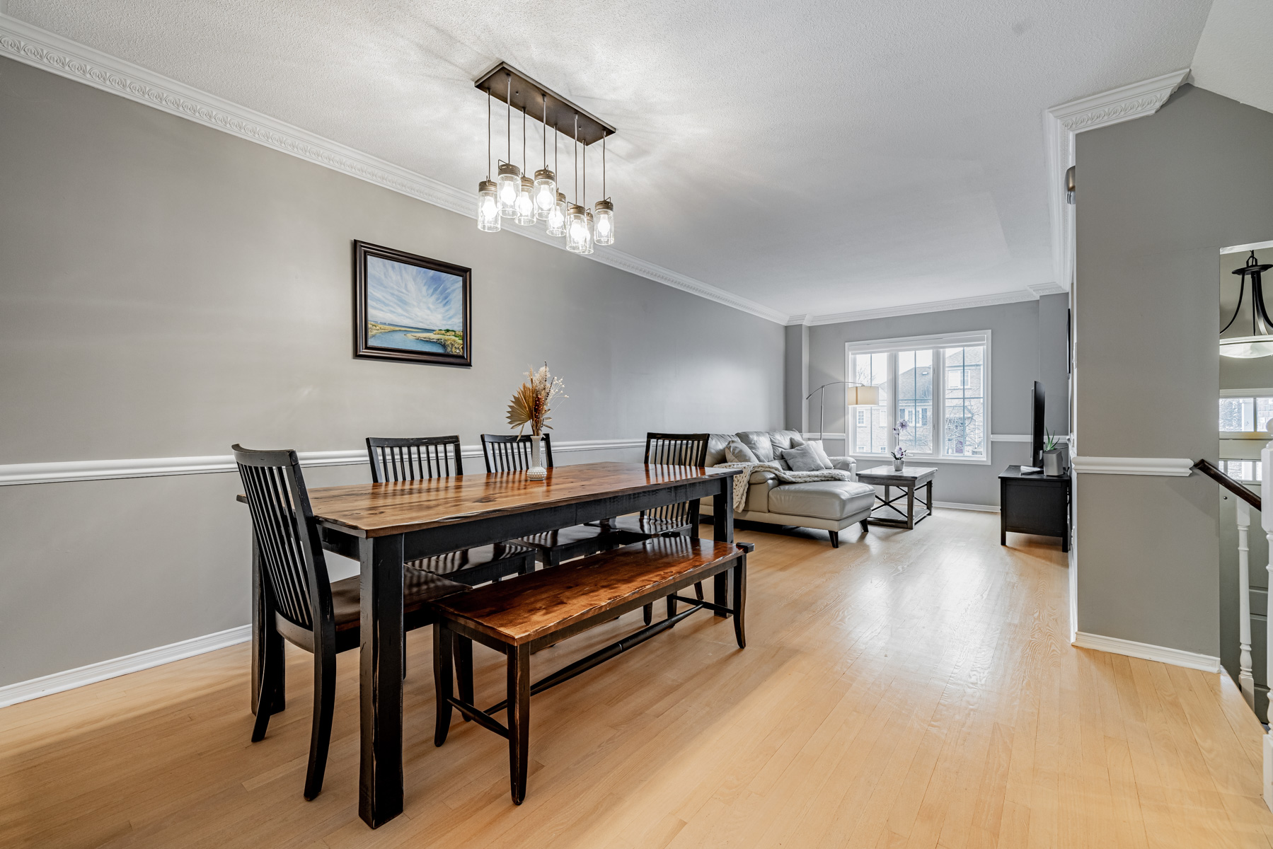 2. 77 Schouten Crescent Dining Room Chandlier Living Room 77 Schouten Cres dining room with chandelier and living room with large windows.