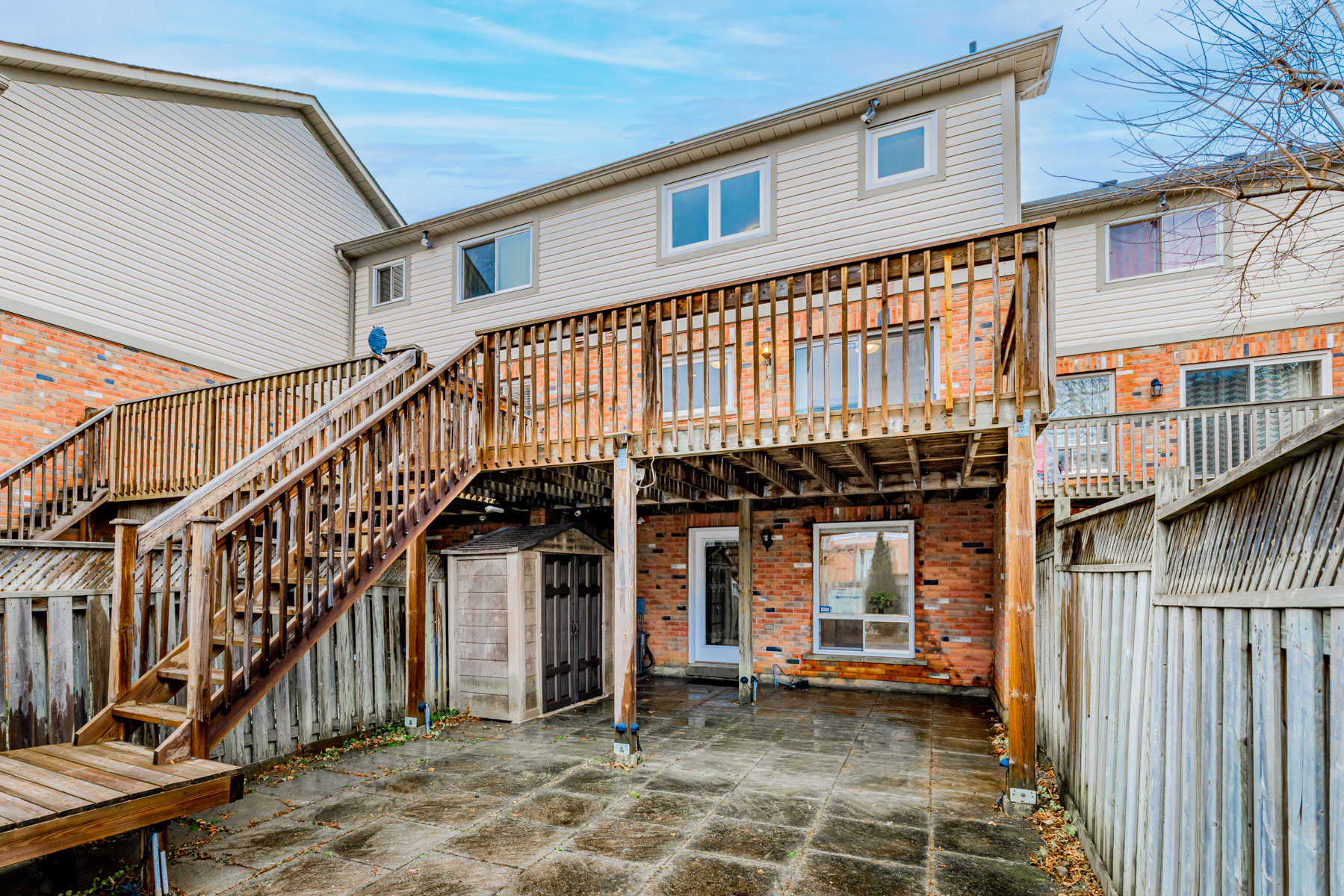 20. 77 Schouten Crescent backyard with huge wooden deck View of 77 Schouten Cres backyard and massive wooden deck.
