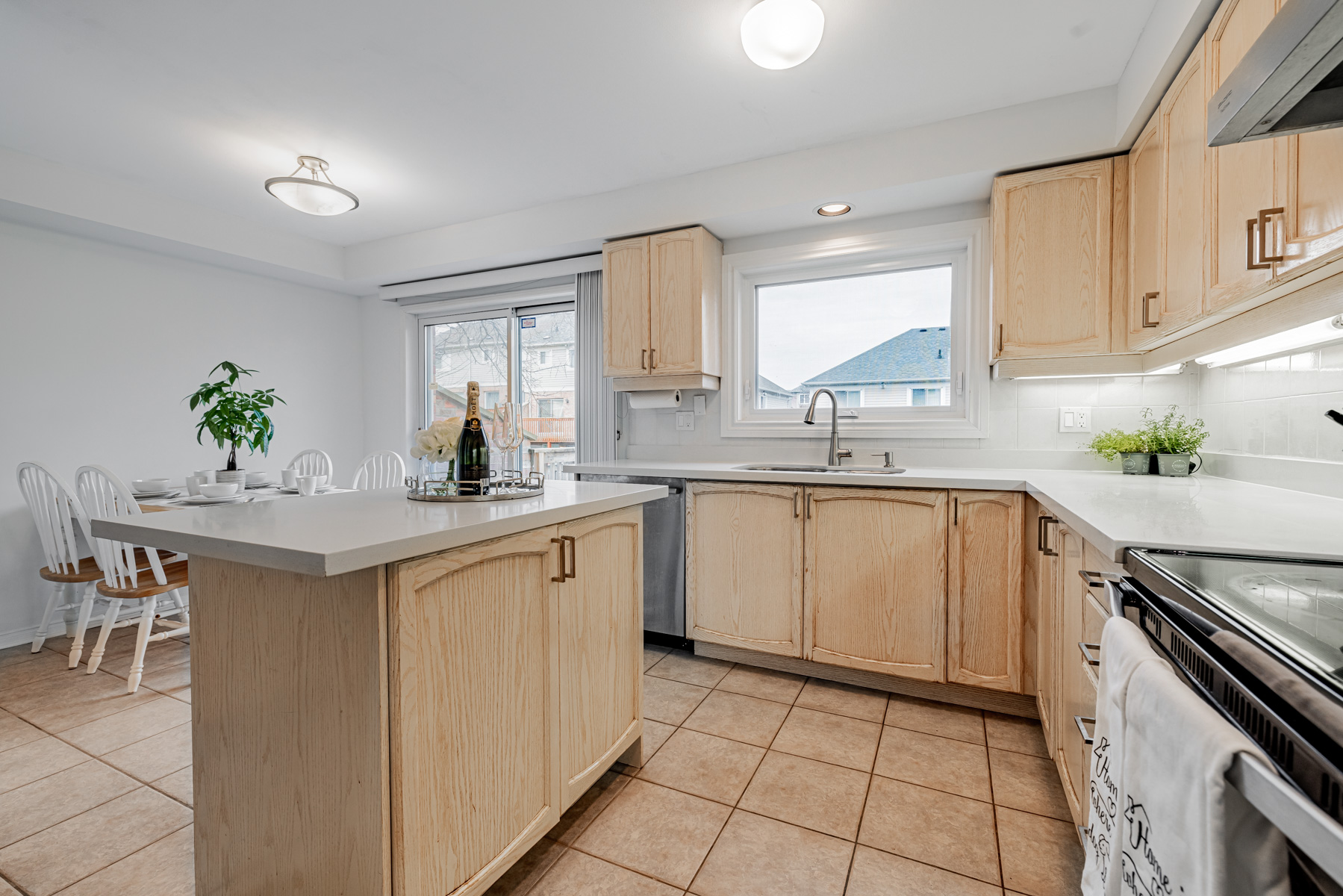 9. 77 Schouten Cres kitchen island with storage Kitchen island with wooden base, granite top and cabinets.